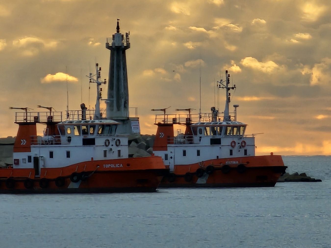 Tugs Topolica and Sozina off the Port of Bar at sunset
