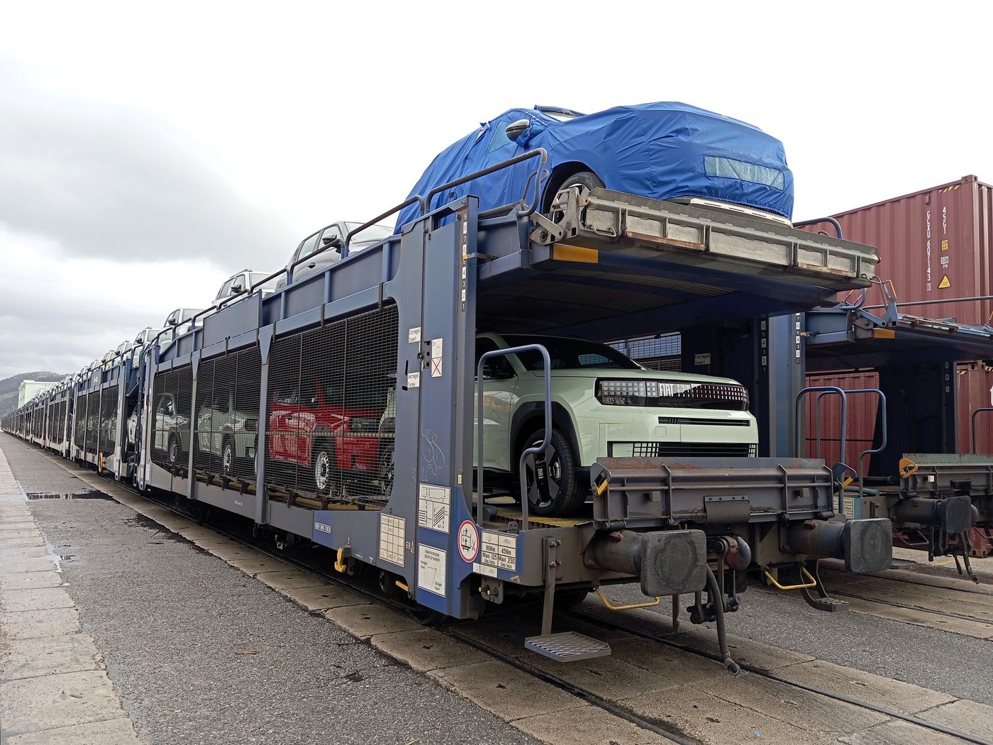 New cars being loaded onto rail wagons in the Port of Bar